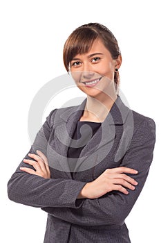 Smiling businesswoman or teacher with arm folded isolated