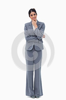 Smiling businesswoman in thoughts
