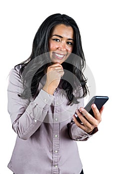 Smiling businesswoman using her smartphone