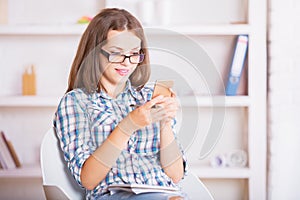 Smiling businesswoman using smartphone