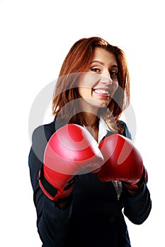 Smiling businesswoman wearing boxing gloves standing