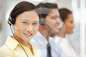 Smiling businesswoman wearing headset