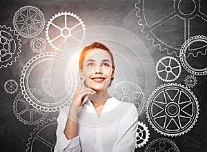 Smiling businesswoman wearing white shirt is thinking about crea