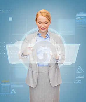 Smiling businesswoman working with virtual screen