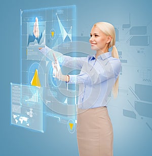 Smiling businesswoman working with virtual screen