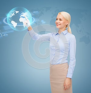 Smiling businesswoman working with virtual screen