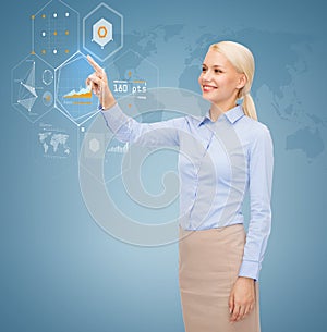 Smiling businesswoman working with virtual screen