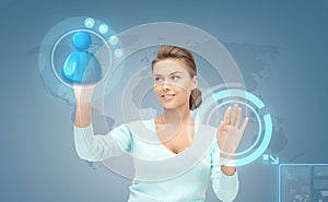 Smiling businesswoman working with virtual screen