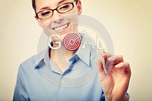 Smiling Businesswoman Writing Goal Text