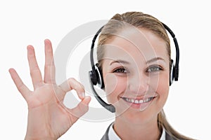Smiling call center agent approving photo