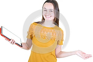 Smiling casual woman using her tablet pc isolated on white background