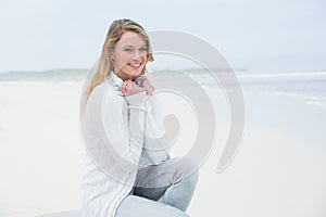 Smiling casual young woman relaxing at beach