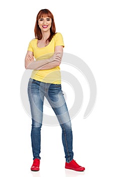 Smiling Casual Young Woman Is Standing With Arms Crossed