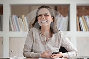 Smiling Caucasian girl look to side talking with mate