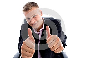 Smiling ceo showing thumbs up with both hands