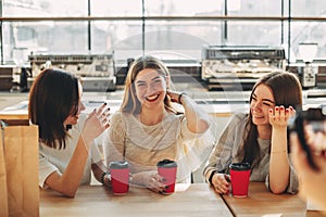 Smiling cheerful woman talk to her friends