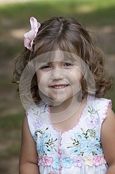 Smiling child with curly hair