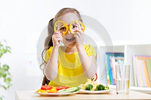 Smiling child eating in kindergarten