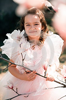 Smiling child with flowers outdoor