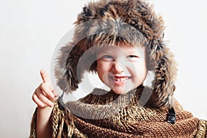 Smiling child in fur Hat.Kids casual winter style.fashion little funny boy.children emotion