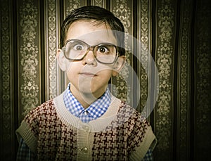 Smiling child with glasses in vintage clothes