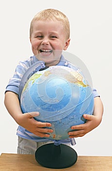 Smiling child with globe