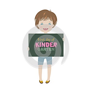 Smiling child holding first day of kindergarten poster