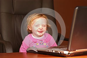 Smiling child with laptop