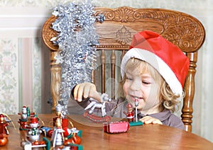 Smiling child in Santa hat