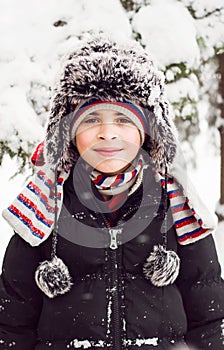 Smiling child in snowy day