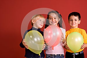 Smiling children with ballons