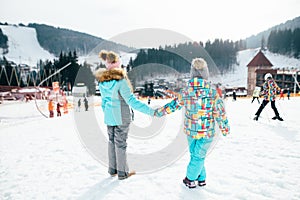 Smiling children enjoying winter vacations in mountains . Ski, Sun, Snow and fun