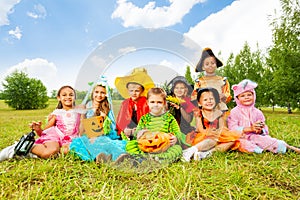 Smiling children in Halloween costumes together