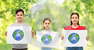 smiling children holding drawing of earth planet