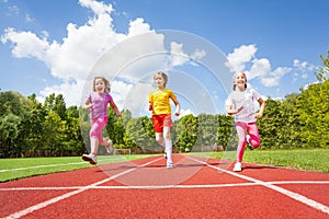 Smiling children running marathon together