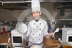 Smiling Chinese cook in kitchen photo