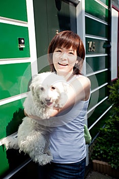 Smiling chinese girl with dog