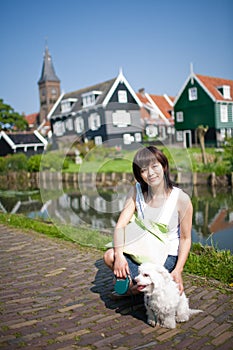 Smiling chinese girl with dog