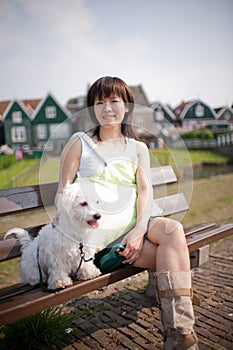 Smiling chinese girl with dog