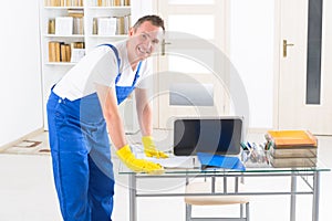 Smiling cleaner at the office