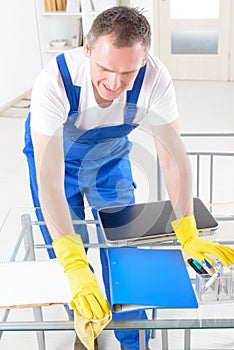 Smiling cleaner at the office