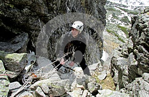 Smiling climber on alpinist route