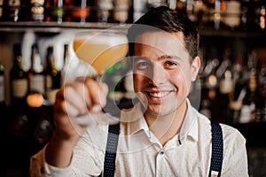 Smiling close up barman with coctail
