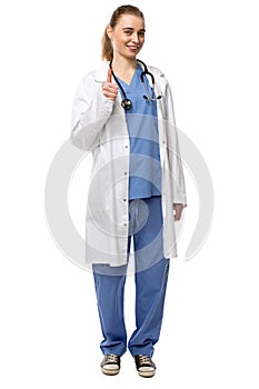 Smiling confident doctor giving a thumbs up