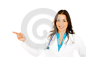 Smiling confident female doctor or nurse or healthcare professional pointing at copy space