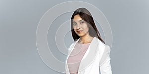 Smiling confident indian businesswoman look at camera isolated on background