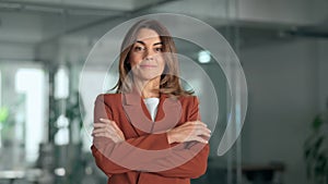 Smiling confident Latin professional mature business woman in office, portrait.