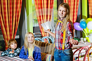 Smiling confused girl waiter takes the order from