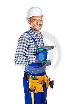 Smiling construction worker with drill and tool belt