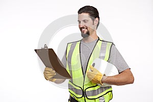 Smiling construction worker going through reports